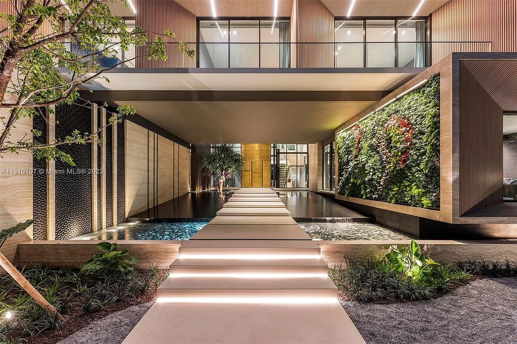 Presenting 98 La Gorce Circle, Miami Beach, Florida an extraordinary Villa Arte by Aquablue Group on Miami Beach's exclusive La Gorce Island. This stunning 7-bedrooms, 13-bathrooms residence spans 14,060 square feet, situated on a 0.76-acre lot.
