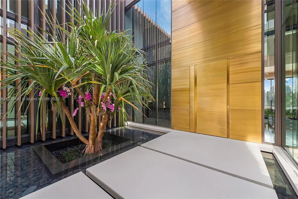 Presenting 98 La Gorce Circle, Miami Beach, Florida an extraordinary Villa Arte by Aquablue Group on Miami Beach's exclusive La Gorce Island. This stunning 7-bedrooms, 13-bathrooms residence spans 14,060 square feet, situated on a 0.76-acre lot.