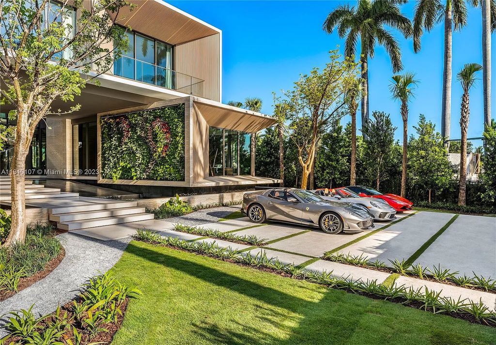 Presenting 98 La Gorce Circle, Miami Beach, Florida an extraordinary Villa Arte by Aquablue Group on Miami Beach's exclusive La Gorce Island. This stunning 7-bedrooms, 13-bathrooms residence spans 14,060 square feet, situated on a 0.76-acre lot.
