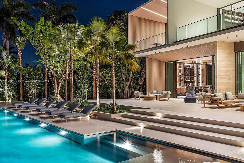 Presenting 98 La Gorce Circle, Miami Beach, Florida an extraordinary Villa Arte by Aquablue Group on Miami Beach's exclusive La Gorce Island. This stunning 7-bedrooms, 13-bathrooms residence spans 14,060 square feet, situated on a 0.76-acre lot.