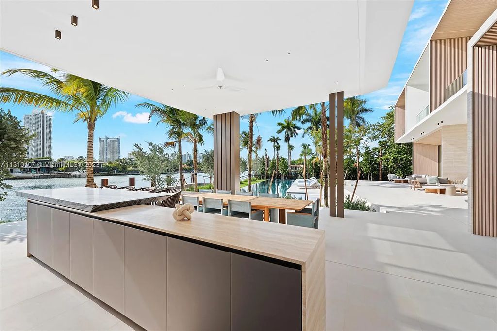 Presenting 98 La Gorce Circle, Miami Beach, Florida an extraordinary Villa Arte by Aquablue Group on Miami Beach's exclusive La Gorce Island. This stunning 7-bedrooms, 13-bathrooms residence spans 14,060 square feet, situated on a 0.76-acre lot.