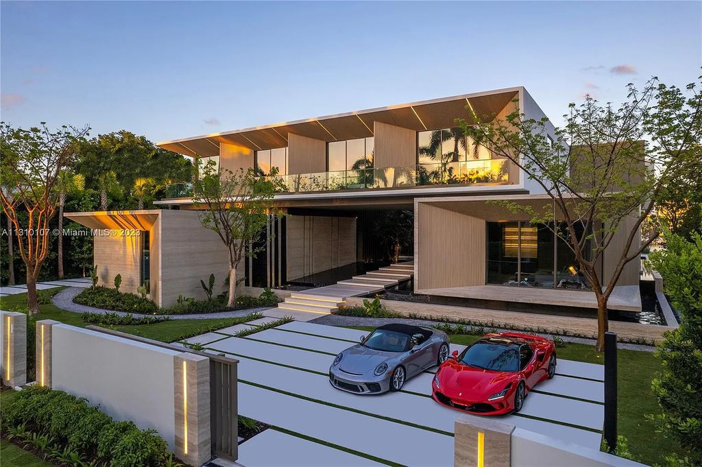 Presenting 98 La Gorce Circle, Miami Beach, Florida an extraordinary Villa Arte by Aquablue Group on Miami Beach's exclusive La Gorce Island. This stunning 7-bedrooms, 13-bathrooms residence spans 14,060 square feet, situated on a 0.76-acre lot.
