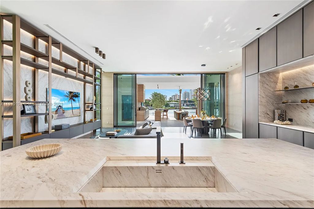 Presenting 98 La Gorce Circle, Miami Beach, Florida an extraordinary Villa Arte by Aquablue Group on Miami Beach's exclusive La Gorce Island. This stunning 7-bedrooms, 13-bathrooms residence spans 14,060 square feet, situated on a 0.76-acre lot.