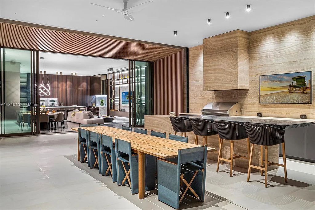 Presenting 98 La Gorce Circle, Miami Beach, Florida an extraordinary Villa Arte by Aquablue Group on Miami Beach's exclusive La Gorce Island. This stunning 7-bedrooms, 13-bathrooms residence spans 14,060 square feet, situated on a 0.76-acre lot.
