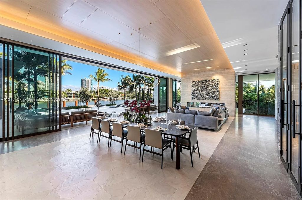 Presenting 98 La Gorce Circle, Miami Beach, Florida an extraordinary Villa Arte by Aquablue Group on Miami Beach's exclusive La Gorce Island. This stunning 7-bedrooms, 13-bathrooms residence spans 14,060 square feet, situated on a 0.76-acre lot.