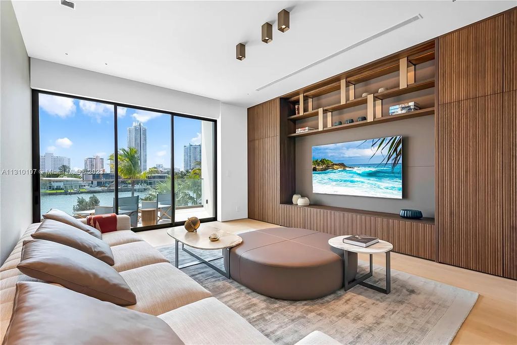 Presenting 98 La Gorce Circle, Miami Beach, Florida an extraordinary Villa Arte by Aquablue Group on Miami Beach's exclusive La Gorce Island. This stunning 7-bedrooms, 13-bathrooms residence spans 14,060 square feet, situated on a 0.76-acre lot.