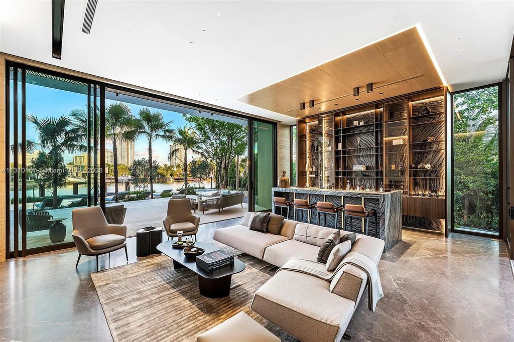 Presenting 98 La Gorce Circle, Miami Beach, Florida an extraordinary Villa Arte by Aquablue Group on Miami Beach's exclusive La Gorce Island. This stunning 7-bedrooms, 13-bathrooms residence spans 14,060 square feet, situated on a 0.76-acre lot.