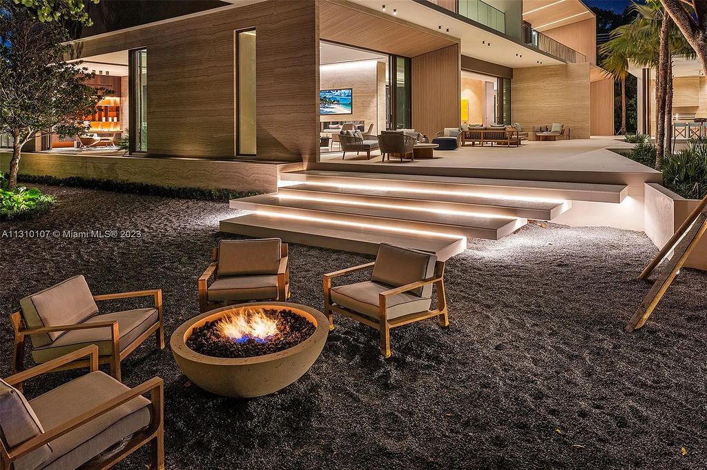 Presenting 98 La Gorce Circle, Miami Beach, Florida an extraordinary Villa Arte by Aquablue Group on Miami Beach's exclusive La Gorce Island. This stunning 7-bedrooms, 13-bathrooms residence spans 14,060 square feet, situated on a 0.76-acre lot.