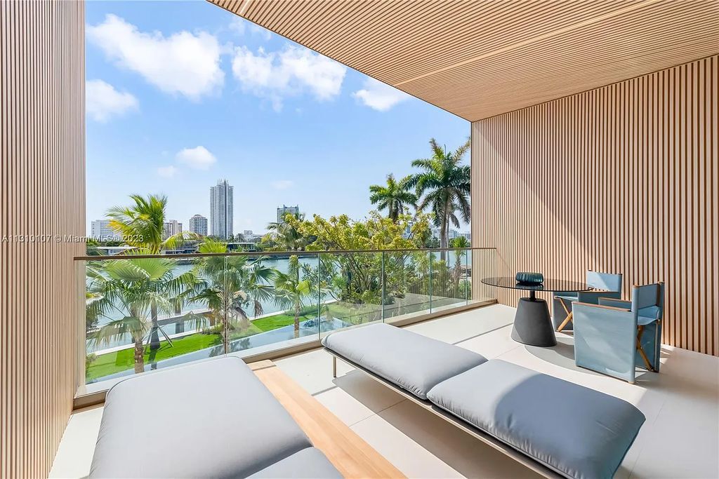 Presenting 98 La Gorce Circle, Miami Beach, Florida an extraordinary Villa Arte by Aquablue Group on Miami Beach's exclusive La Gorce Island. This stunning 7-bedrooms, 13-bathrooms residence spans 14,060 square feet, situated on a 0.76-acre lot.
