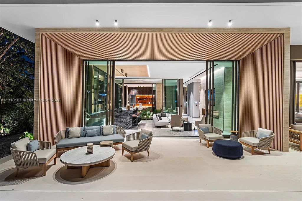 Presenting 98 La Gorce Circle, Miami Beach, Florida an extraordinary Villa Arte by Aquablue Group on Miami Beach's exclusive La Gorce Island. This stunning 7-bedrooms, 13-bathrooms residence spans 14,060 square feet, situated on a 0.76-acre lot.