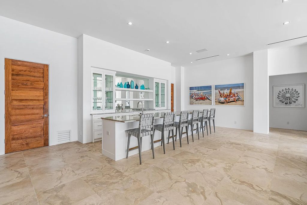Experience luxury living at 17553 SE Conch Bar Avenue, Jupiter, Florida! This One-Of-A-Kind Grand Intracoastal Estate boasts 9 bedrooms, 10 bathrooms, and 15,066 square feet of living space on a 0.43-acre lot.