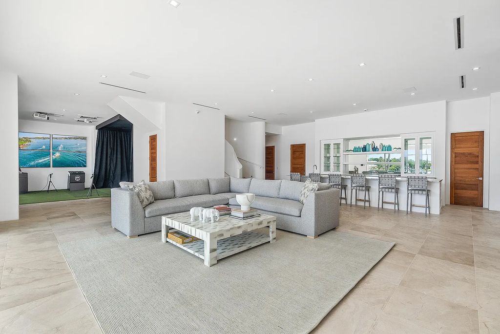 Experience luxury living at 17553 SE Conch Bar Avenue, Jupiter, Florida! This One-Of-A-Kind Grand Intracoastal Estate boasts 9 bedrooms, 10 bathrooms, and 15,066 square feet of living space on a 0.43-acre lot.