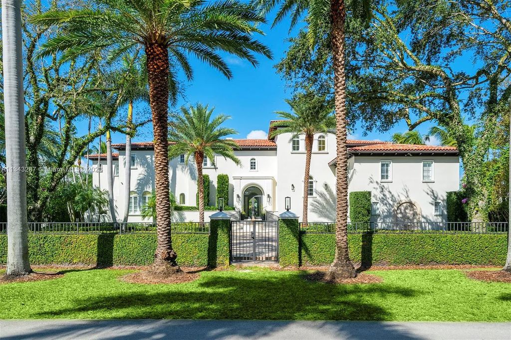Experience luxurious waterfront living at 365 Arvida Pkwy, Coral Gables, Florida. This 11,946 sq ft masterpiece in Gables Estates offers 8 bedrooms, 11 baths, and 180 ft of waterfrontage. The main suite features a private balcony, spa-like bathroom, and walk-in closets.