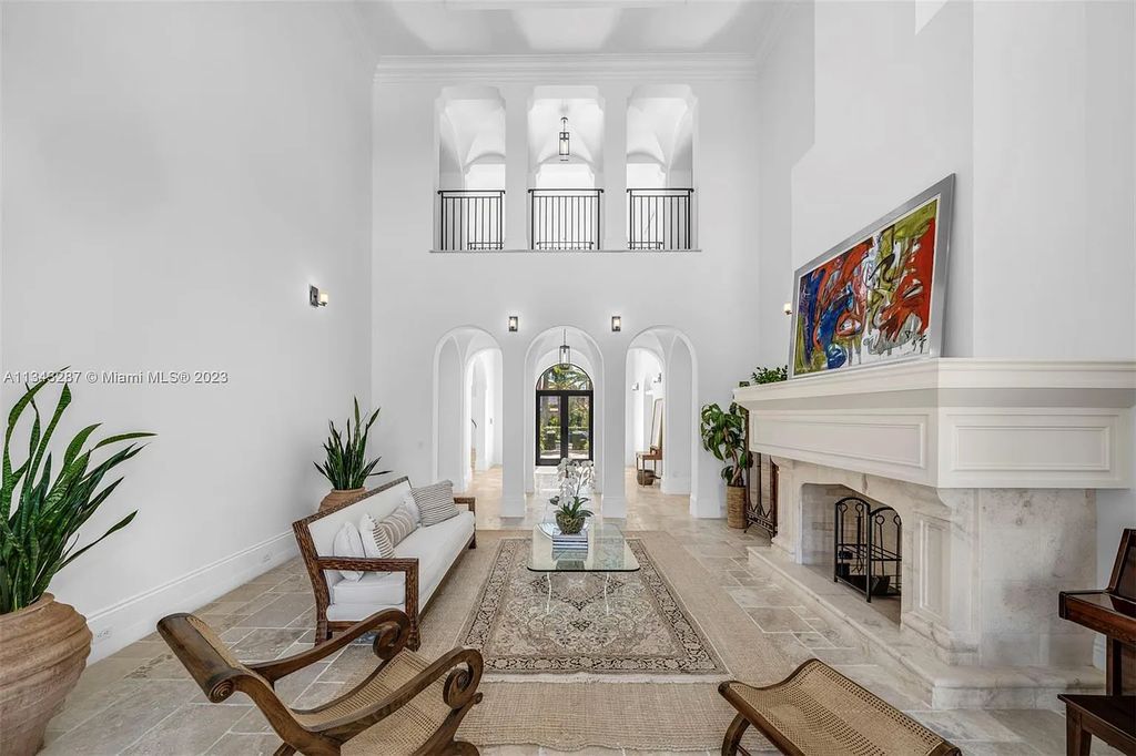 Experience luxurious waterfront living at 365 Arvida Pkwy, Coral Gables, Florida. This 11,946 sq ft masterpiece in Gables Estates offers 8 bedrooms, 11 baths, and 180 ft of waterfrontage. The main suite features a private balcony, spa-like bathroom, and walk-in closets.