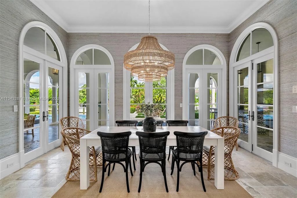 Experience luxurious waterfront living at 365 Arvida Pkwy, Coral Gables, Florida. This 11,946 sq ft masterpiece in Gables Estates offers 8 bedrooms, 11 baths, and 180 ft of waterfrontage. The main suite features a private balcony, spa-like bathroom, and walk-in closets.