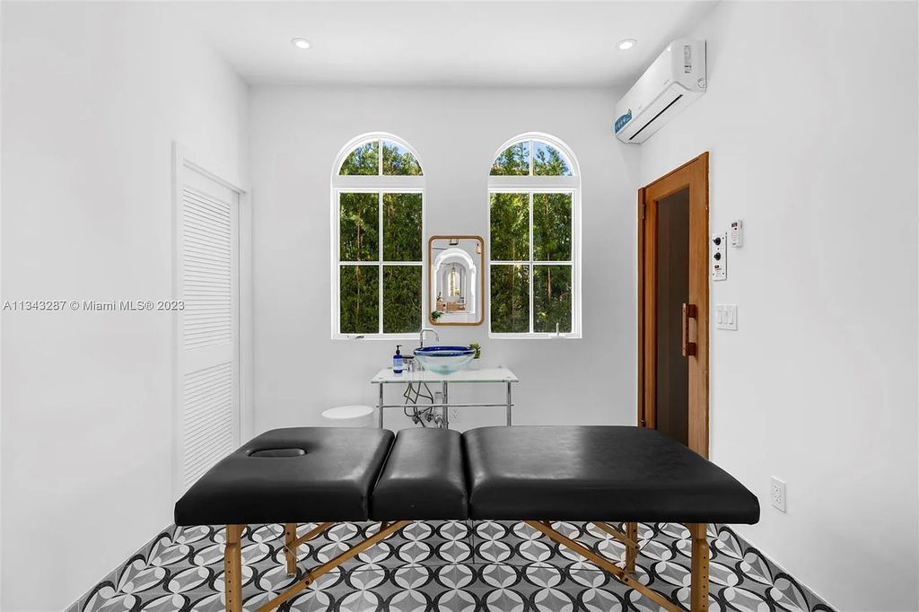 Experience luxurious waterfront living at 365 Arvida Pkwy, Coral Gables, Florida. This 11,946 sq ft masterpiece in Gables Estates offers 8 bedrooms, 11 baths, and 180 ft of waterfrontage. The main suite features a private balcony, spa-like bathroom, and walk-in closets.
