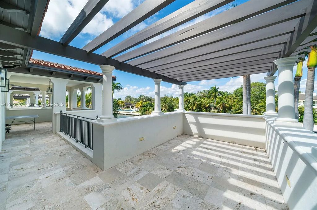 Experience luxurious waterfront living at 365 Arvida Pkwy, Coral Gables, Florida. This 11,946 sq ft masterpiece in Gables Estates offers 8 bedrooms, 11 baths, and 180 ft of waterfrontage. The main suite features a private balcony, spa-like bathroom, and walk-in closets.