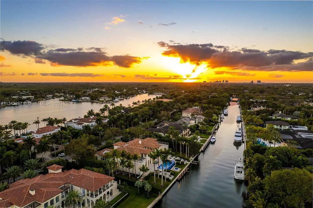 Experience luxurious waterfront living at 365 Arvida Pkwy, Coral Gables, Florida. This 11,946 sq ft masterpiece in Gables Estates offers 8 bedrooms, 11 baths, and 180 ft of waterfrontage. The main suite features a private balcony, spa-like bathroom, and walk-in closets.