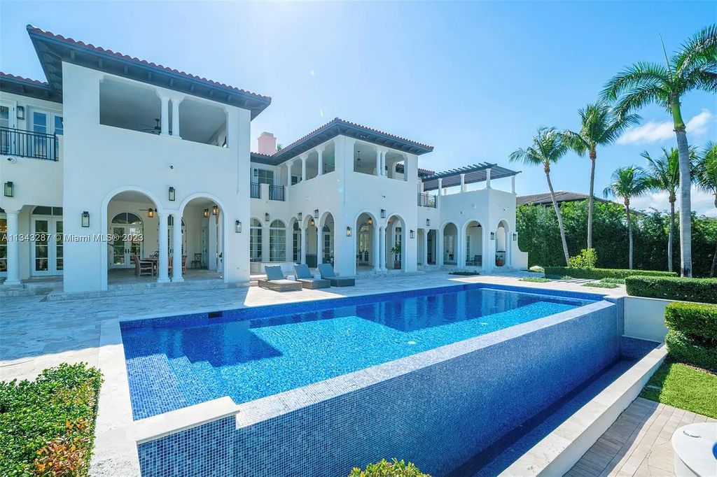 Experience luxurious waterfront living at 365 Arvida Pkwy, Coral Gables, Florida. This 11,946 sq ft masterpiece in Gables Estates offers 8 bedrooms, 11 baths, and 180 ft of waterfrontage. The main suite features a private balcony, spa-like bathroom, and walk-in closets.