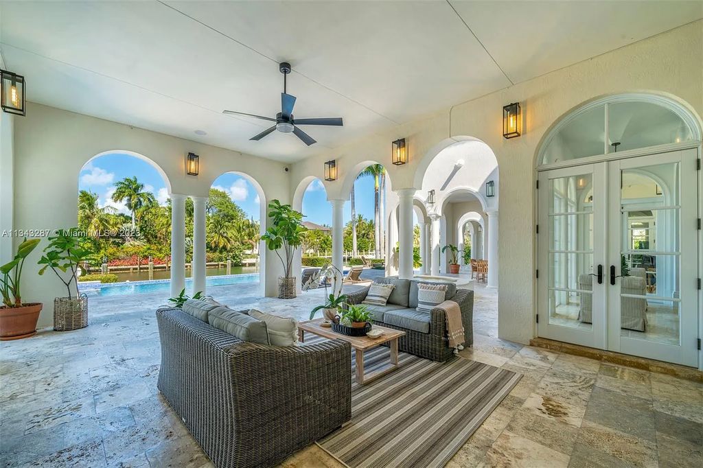 Experience luxurious waterfront living at 365 Arvida Pkwy, Coral Gables, Florida. This 11,946 sq ft masterpiece in Gables Estates offers 8 bedrooms, 11 baths, and 180 ft of waterfrontage. The main suite features a private balcony, spa-like bathroom, and walk-in closets.