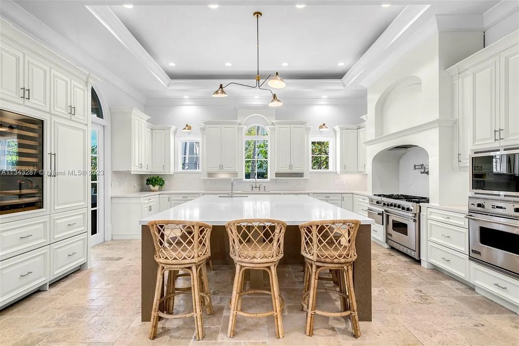 Experience luxurious waterfront living at 365 Arvida Pkwy, Coral Gables, Florida. This 11,946 sq ft masterpiece in Gables Estates offers 8 bedrooms, 11 baths, and 180 ft of waterfrontage. The main suite features a private balcony, spa-like bathroom, and walk-in closets.