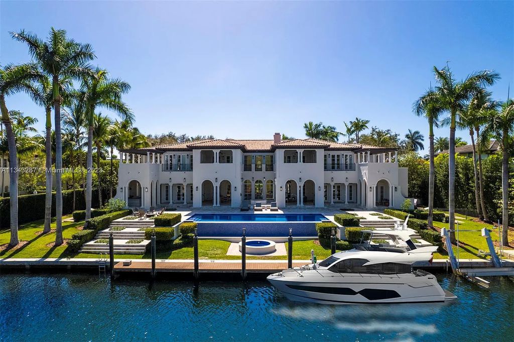 Experience luxurious waterfront living at 365 Arvida Pkwy, Coral Gables, Florida. This 11,946 sq ft masterpiece in Gables Estates offers 8 bedrooms, 11 baths, and 180 ft of waterfrontage. The main suite features a private balcony, spa-like bathroom, and walk-in closets.