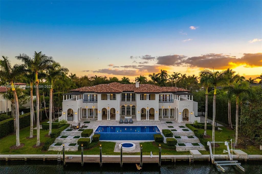 Experience luxurious waterfront living at 365 Arvida Pkwy, Coral Gables, Florida. This 11,946 sq ft masterpiece in Gables Estates offers 8 bedrooms, 11 baths, and 180 ft of waterfrontage. The main suite features a private balcony, spa-like bathroom, and walk-in closets.
