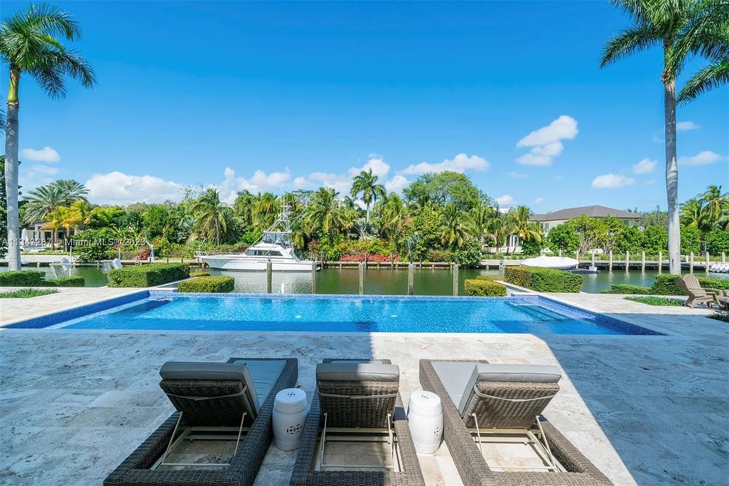 Experience luxurious waterfront living at 365 Arvida Pkwy, Coral Gables, Florida. This 11,946 sq ft masterpiece in Gables Estates offers 8 bedrooms, 11 baths, and 180 ft of waterfrontage. The main suite features a private balcony, spa-like bathroom, and walk-in closets.