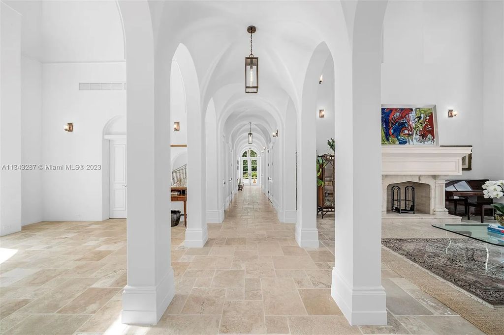 Experience luxurious waterfront living at 365 Arvida Pkwy, Coral Gables, Florida. This 11,946 sq ft masterpiece in Gables Estates offers 8 bedrooms, 11 baths, and 180 ft of waterfrontage. The main suite features a private balcony, spa-like bathroom, and walk-in closets.