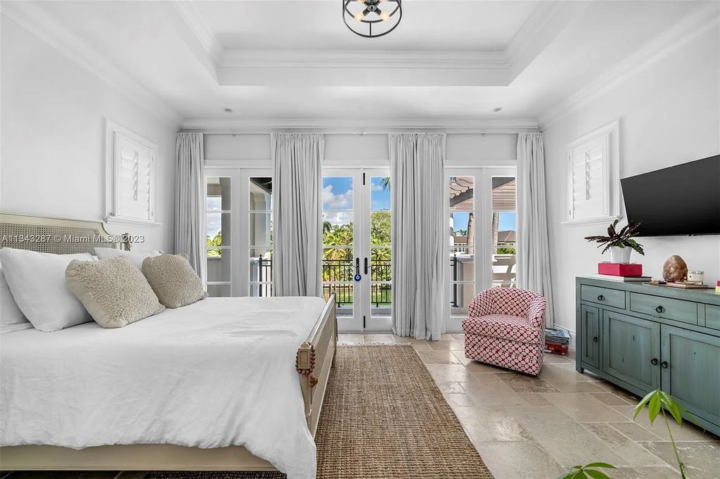 Experience luxurious waterfront living at 365 Arvida Pkwy, Coral Gables, Florida. This 11,946 sq ft masterpiece in Gables Estates offers 8 bedrooms, 11 baths, and 180 ft of waterfrontage. The main suite features a private balcony, spa-like bathroom, and walk-in closets.