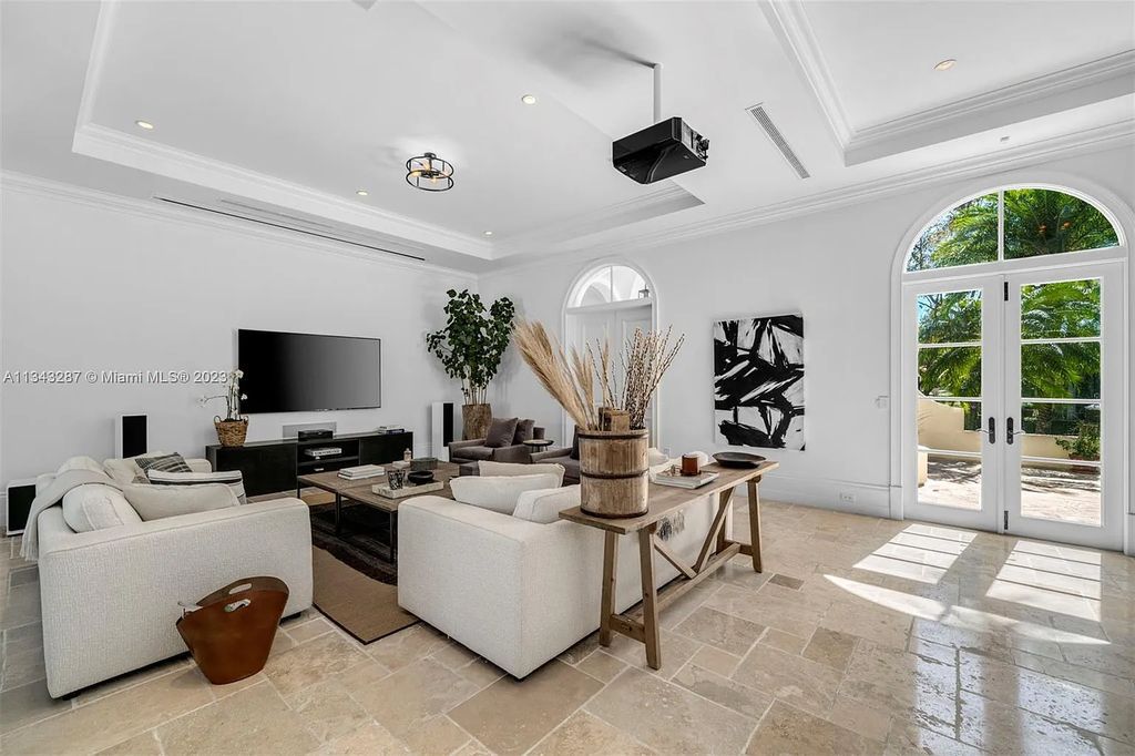 Experience luxurious waterfront living at 365 Arvida Pkwy, Coral Gables, Florida. This 11,946 sq ft masterpiece in Gables Estates offers 8 bedrooms, 11 baths, and 180 ft of waterfrontage. The main suite features a private balcony, spa-like bathroom, and walk-in closets.