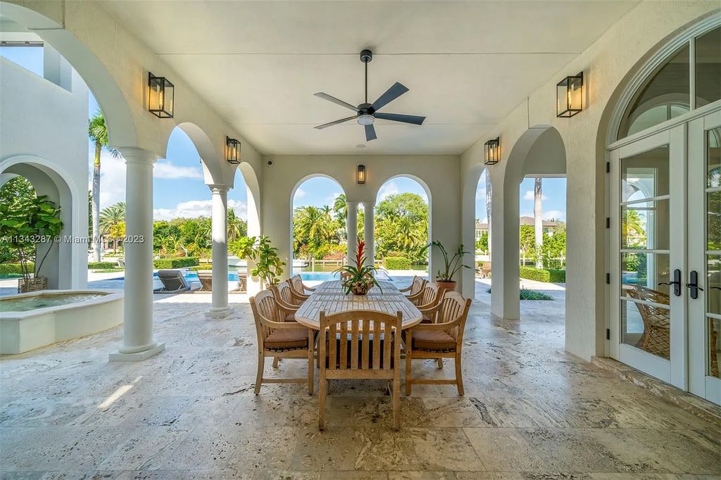 Experience luxurious waterfront living at 365 Arvida Pkwy, Coral Gables, Florida. This 11,946 sq ft masterpiece in Gables Estates offers 8 bedrooms, 11 baths, and 180 ft of waterfrontage. The main suite features a private balcony, spa-like bathroom, and walk-in closets.