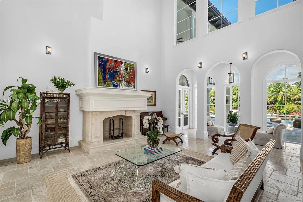 Experience luxurious waterfront living at 365 Arvida Pkwy, Coral Gables, Florida. This 11,946 sq ft masterpiece in Gables Estates offers 8 bedrooms, 11 baths, and 180 ft of waterfrontage. The main suite features a private balcony, spa-like bathroom, and walk-in closets.