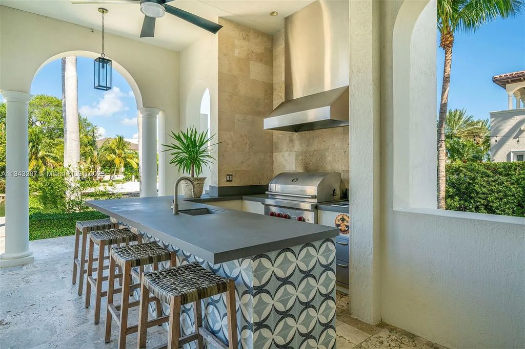 Experience luxurious waterfront living at 365 Arvida Pkwy, Coral Gables, Florida. This 11,946 sq ft masterpiece in Gables Estates offers 8 bedrooms, 11 baths, and 180 ft of waterfrontage. The main suite features a private balcony, spa-like bathroom, and walk-in closets.