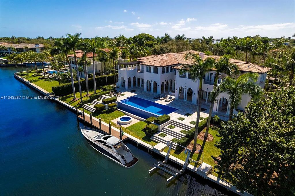 Experience luxurious waterfront living at 365 Arvida Pkwy, Coral Gables, Florida. This 11,946 sq ft masterpiece in Gables Estates offers 8 bedrooms, 11 baths, and 180 ft of waterfrontage. The main suite features a private balcony, spa-like bathroom, and walk-in closets.