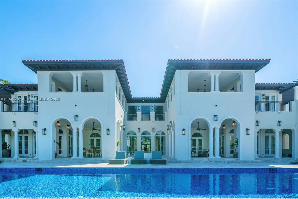 Experience luxurious waterfront living at 365 Arvida Pkwy, Coral Gables, Florida. This 11,946 sq ft masterpiece in Gables Estates offers 8 bedrooms, 11 baths, and 180 ft of waterfrontage. The main suite features a private balcony, spa-like bathroom, and walk-in closets.