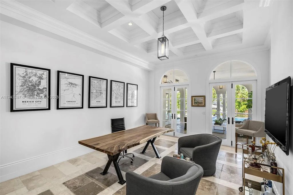 Experience luxurious waterfront living at 365 Arvida Pkwy, Coral Gables, Florida. This 11,946 sq ft masterpiece in Gables Estates offers 8 bedrooms, 11 baths, and 180 ft of waterfrontage. The main suite features a private balcony, spa-like bathroom, and walk-in closets.