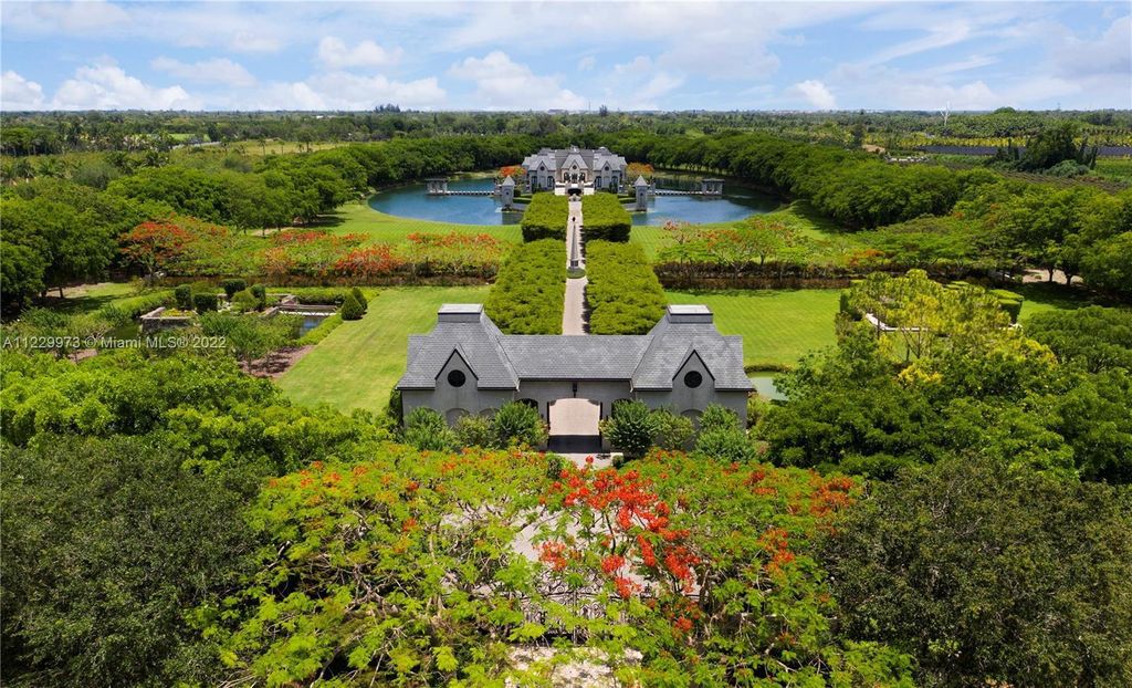 Welcome to 25791 SW 167th Avenue, Homestead, Florida - a rare chance to own the renowned mansion, designed by Architect Charles Sieger. This extraordinary 12,770 square feet estate sits on 13.74 acres in the serene Redlands area.