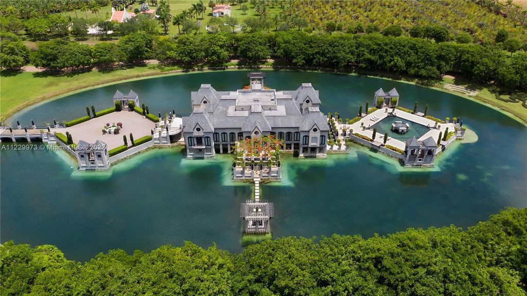 Welcome to 25791 SW 167th Avenue, Homestead, Florida - a rare chance to own the renowned mansion, designed by Architect Charles Sieger. This extraordinary 12,770 square feet estate sits on 13.74 acres in the serene Redlands area.