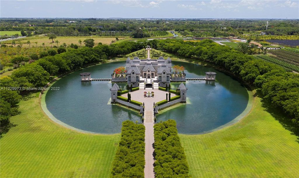 Welcome to 25791 SW 167th Avenue, Homestead, Florida - a rare chance to own the renowned mansion, designed by Architect Charles Sieger. This extraordinary 12,770 square feet estate sits on 13.74 acres in the serene Redlands area.