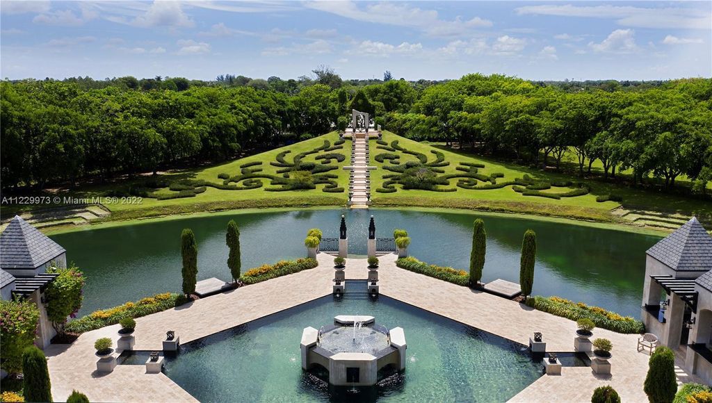 Welcome to 25791 SW 167th Avenue, Homestead, Florida - a rare chance to own the renowned mansion, designed by Architect Charles Sieger. This extraordinary 12,770 square feet estate sits on 13.74 acres in the serene Redlands area.