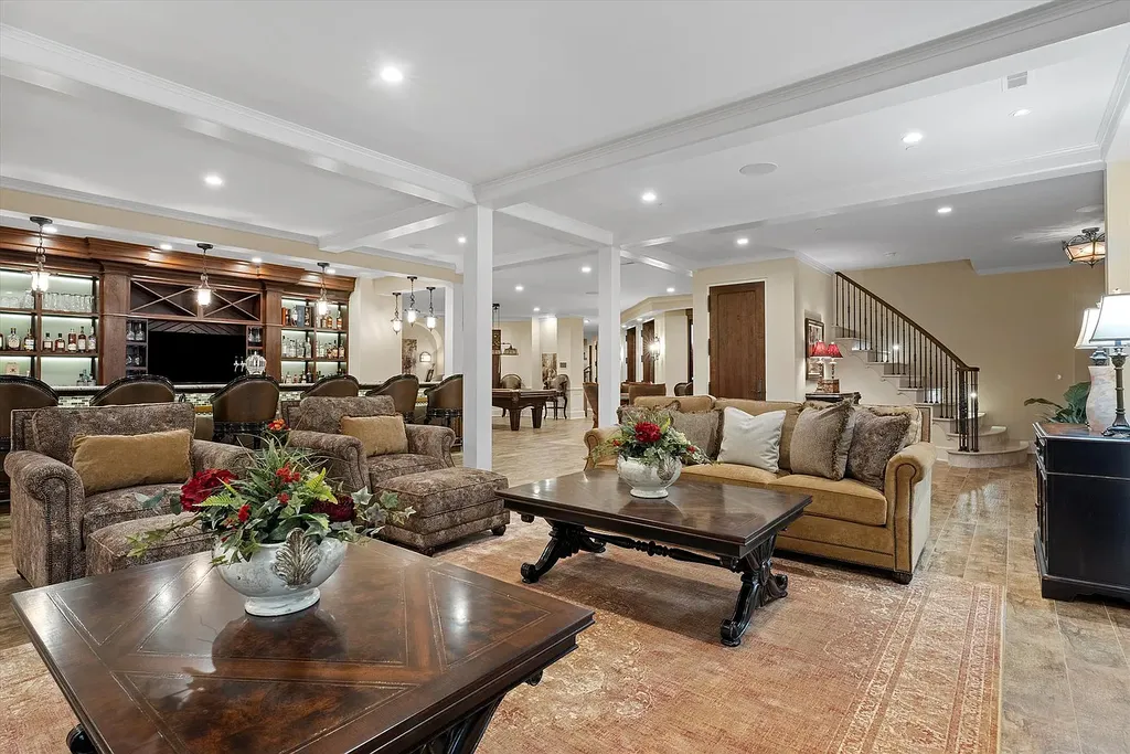 1112 Shamrock Court Home in Naperville, Illinois. Welcome to your own private resort-like manor in Naperville, one of America's top suburbs. This custom-built home by David Knecht offers over 21,000 square feet of luxury living space, including 7 bedrooms and 9.3 baths. The stunning exterior features Tudor-style brick and limestone, while the interior boasts top-of-the-line finishes and amenities. 