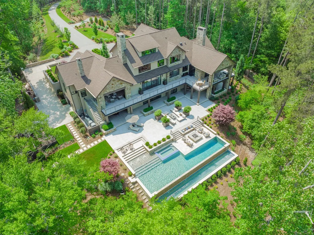 125 Quiet Waters Drive Home in Mooresville, North Carolina. Embark on a journey of timeless elegance and unrivaled luxury at 125 Quiet Waters Drive, Mooresville, NC 28117. Quiet Waters is not just a residence; it is a testament to the art of living, where tranquility, sophistication, and natural beauty intertwine to create an unforgettable masterpiece.