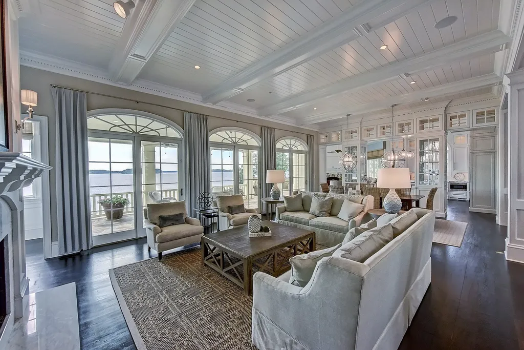 Indulge in the allure and character of the New England coast with this extraordinary Lake Norman estate. As you enter through the private gated drive, you'll be greeted by lush landscaping, creating a gardener's paradise. The estate offers wide open, long-range panoramic views that will take your breath away.