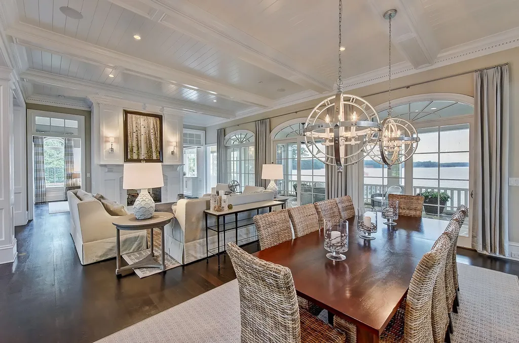 Indulge in the allure and character of the New England coast with this extraordinary Lake Norman estate. As you enter through the private gated drive, you'll be greeted by lush landscaping, creating a gardener's paradise. The estate offers wide open, long-range panoramic views that will take your breath away.