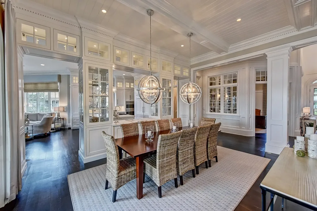 Indulge in the allure and character of the New England coast with this extraordinary Lake Norman estate. As you enter through the private gated drive, you'll be greeted by lush landscaping, creating a gardener's paradise. The estate offers wide open, long-range panoramic views that will take your breath away.