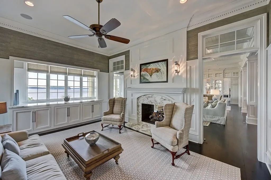 Indulge in the allure and character of the New England coast with this extraordinary Lake Norman estate. As you enter through the private gated drive, you'll be greeted by lush landscaping, creating a gardener's paradise. The estate offers wide open, long-range panoramic views that will take your breath away.
