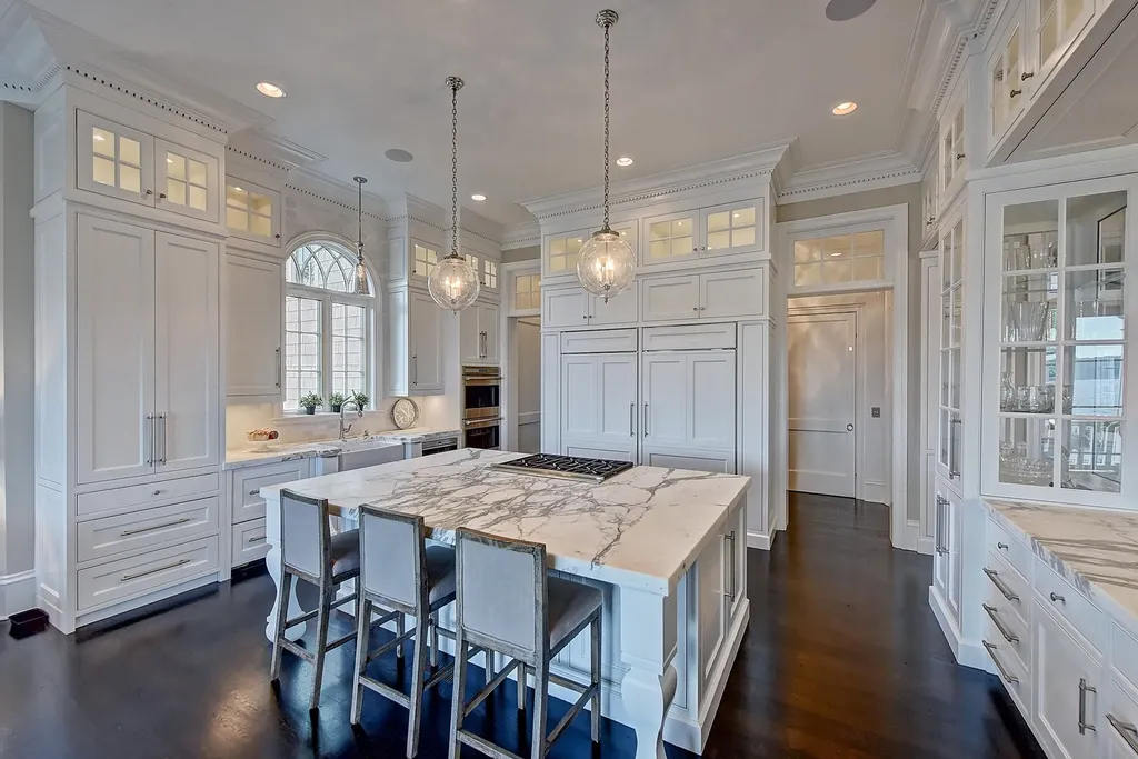 Indulge in the allure and character of the New England coast with this extraordinary Lake Norman estate. As you enter through the private gated drive, you'll be greeted by lush landscaping, creating a gardener's paradise. The estate offers wide open, long-range panoramic views that will take your breath away.
