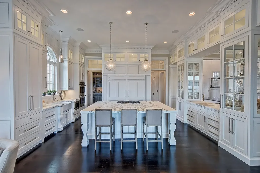 Indulge in the allure and character of the New England coast with this extraordinary Lake Norman estate. As you enter through the private gated drive, you'll be greeted by lush landscaping, creating a gardener's paradise. The estate offers wide open, long-range panoramic views that will take your breath away.