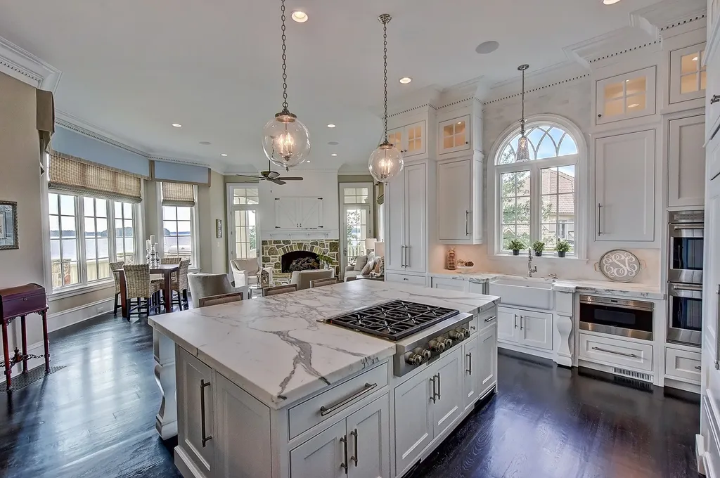 Indulge in the allure and character of the New England coast with this extraordinary Lake Norman estate. As you enter through the private gated drive, you'll be greeted by lush landscaping, creating a gardener's paradise. The estate offers wide open, long-range panoramic views that will take your breath away.